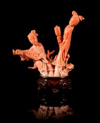 A Pink Coral Figural Group of Two Female Musicians Height 4 3/4 inches.