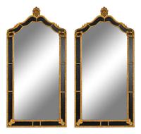 A Pair of Large Ebonized and Parcel Gilt Pier Mirrors