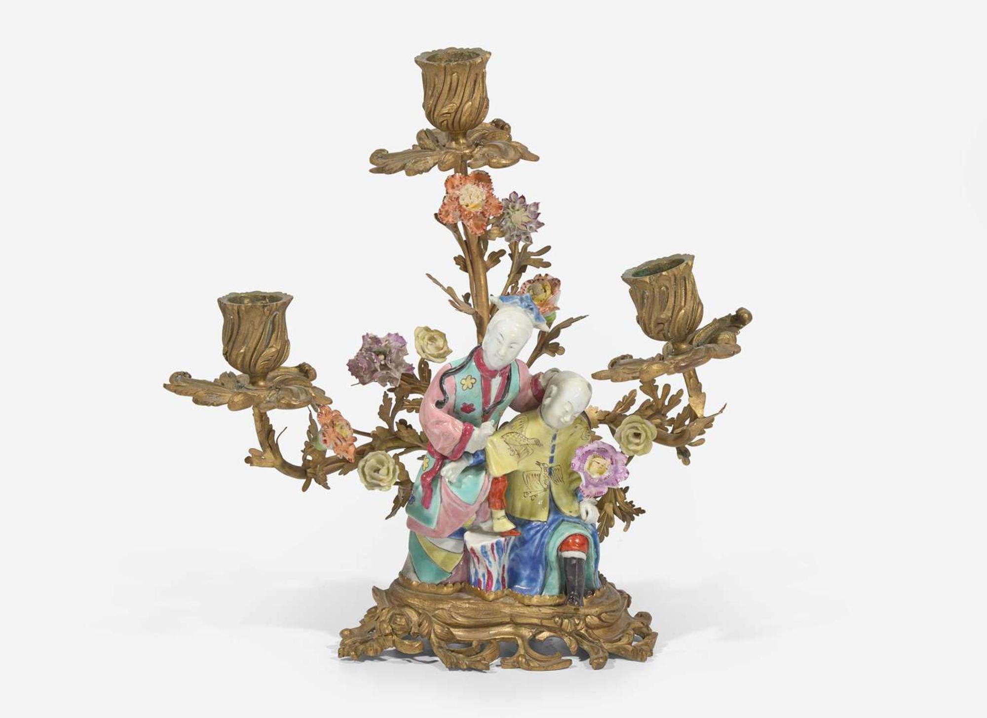 A gilt-bronze mounted Chinese figural porcelain three-light candelabra, the figure 18th century, the gilt bronze 19th century