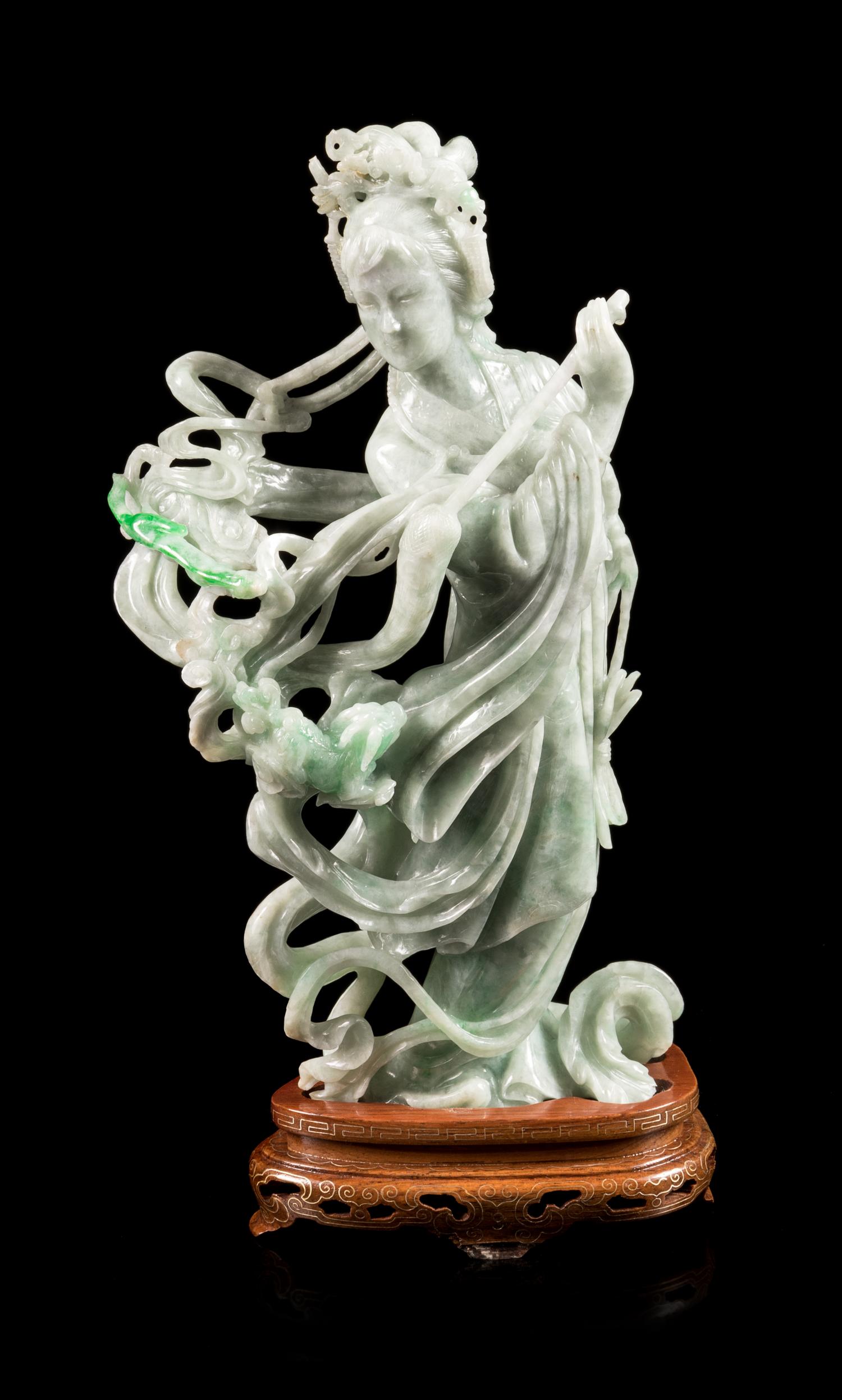 A Chinese Apple Green and Pale Celadon Jadeite Figure of a Female Immortal