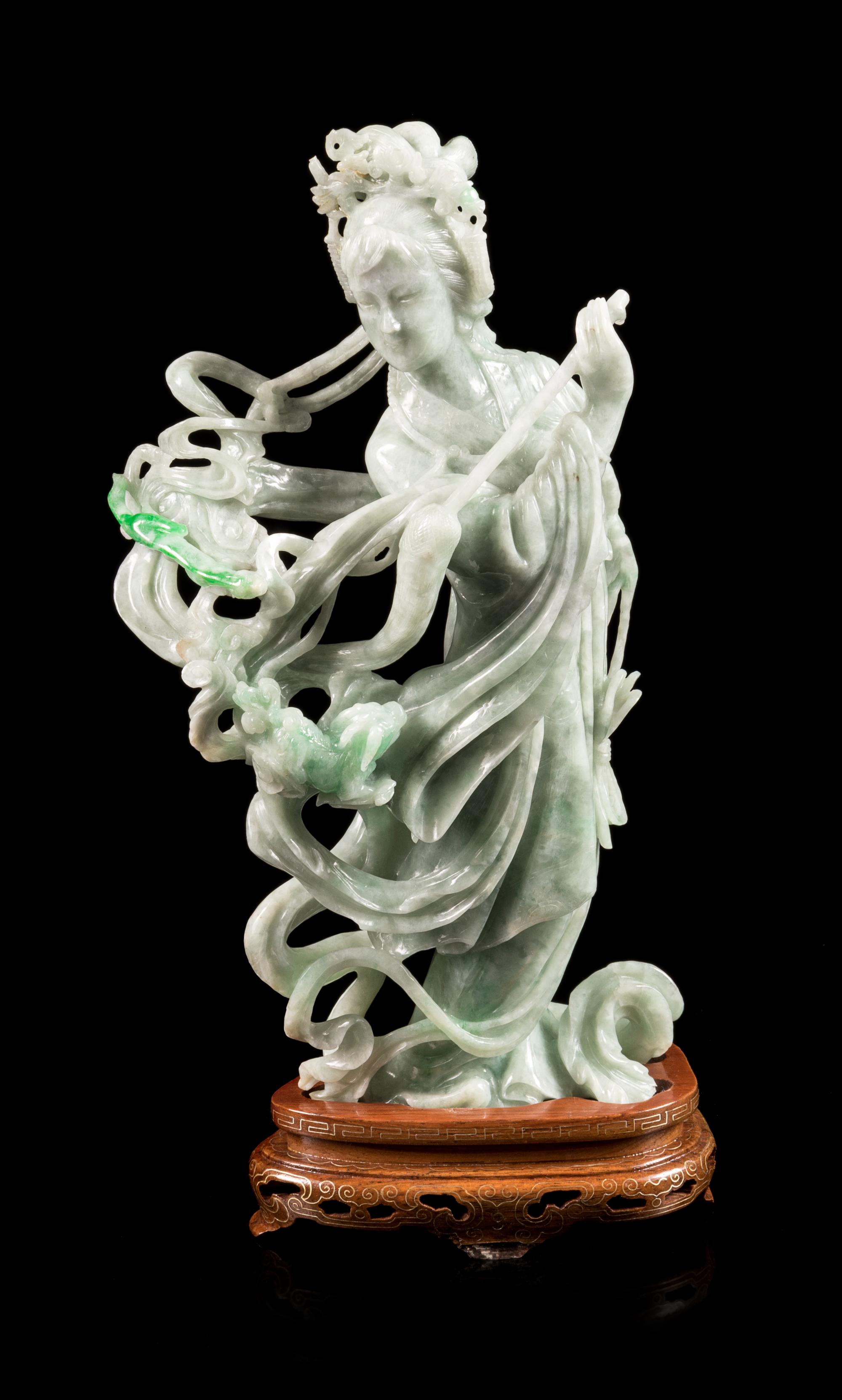 A Chinese Apple Green and Pale Celadon Jadeite Figure of a Female Immortal