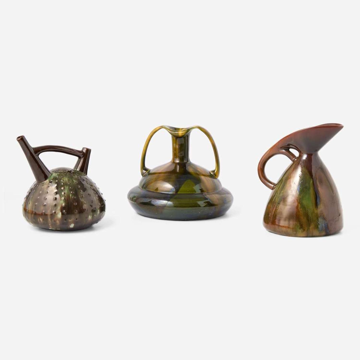 Three glazed earthenware jugs Christopher Dresser (English, 1834-1904), Ault Pottery (1887-1922) and Linthorpe Pottery Works (1879-1889), England, circa 1890 and 1879-1882 respectively