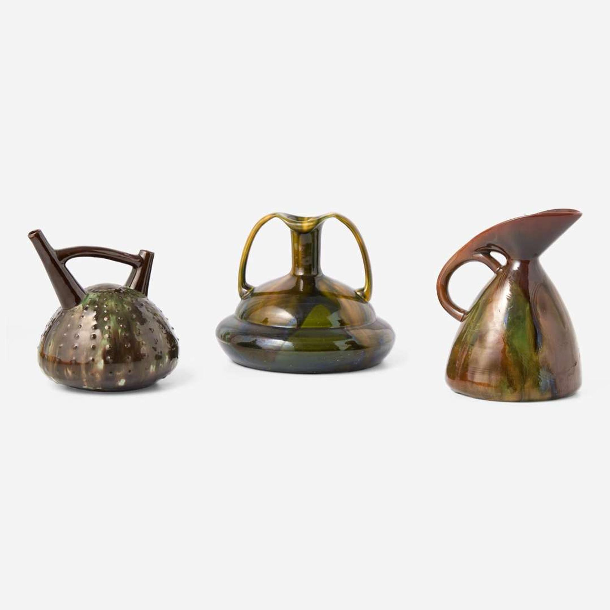 Three glazed earthenware jugs Christopher Dresser (English, 1834-1904), Ault Pottery (1887-1922) and Linthorpe Pottery Works (1879-1889), England, circa 1890 and 1879-1882 respectively