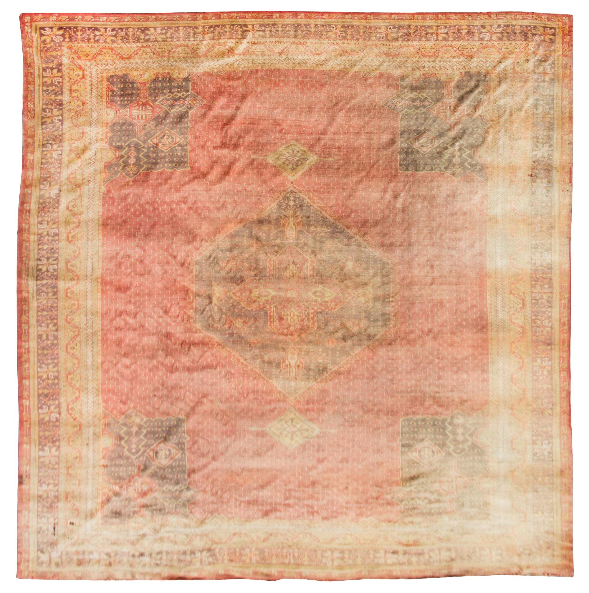 A Persian Wool Rug 18 feet 8 inches x 16 feet x 4 inches.