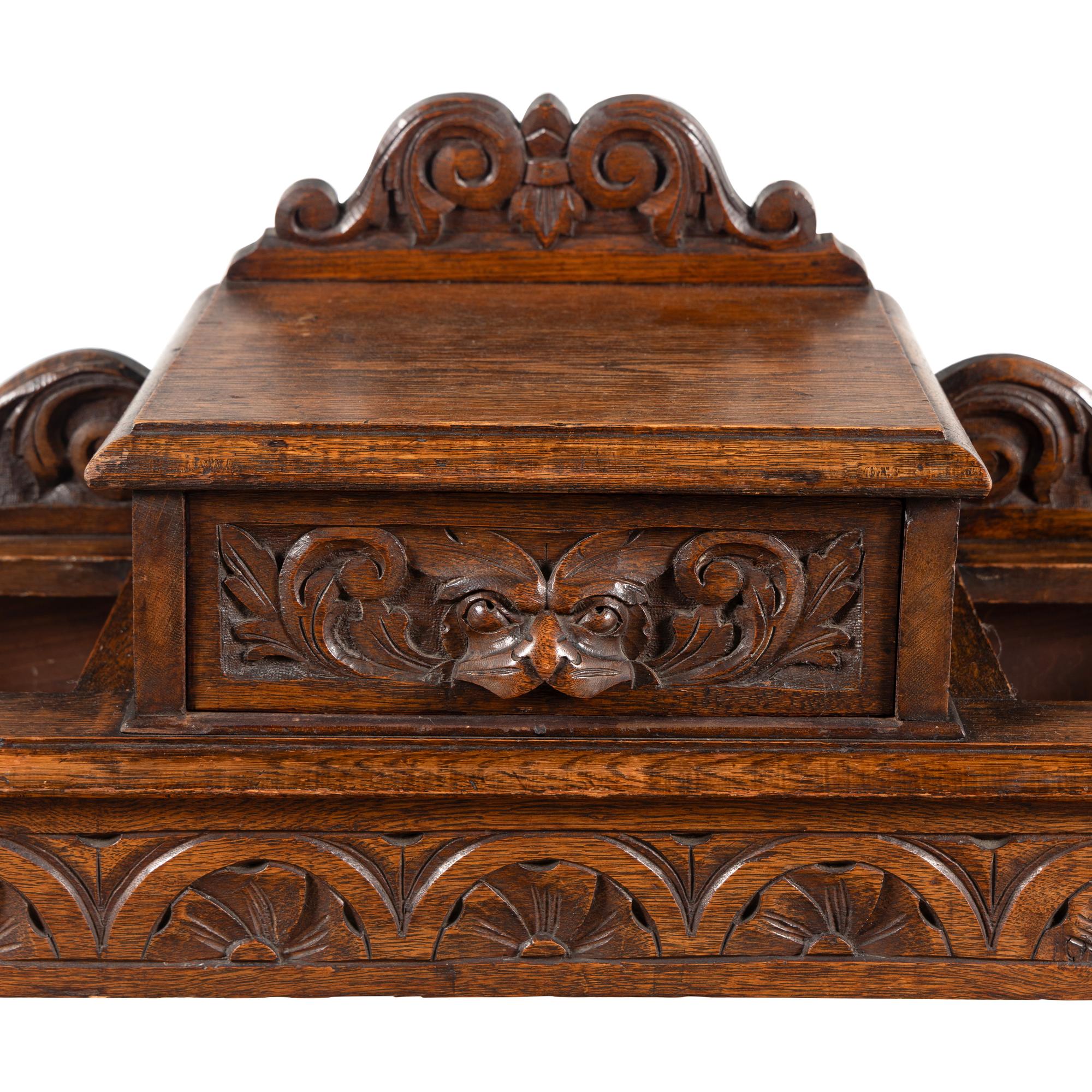 An English Renaissance Revival Carved Oak Umbrella Stand