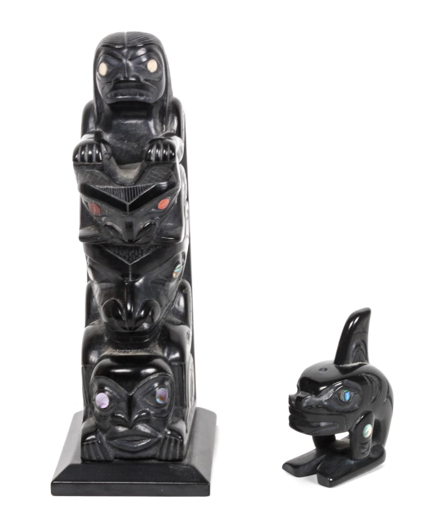 An Argillite Inuit Carving, Glen Pollard Height of the first 5 3/8 x width 1 7/8 x depth 2 1/2 inches.