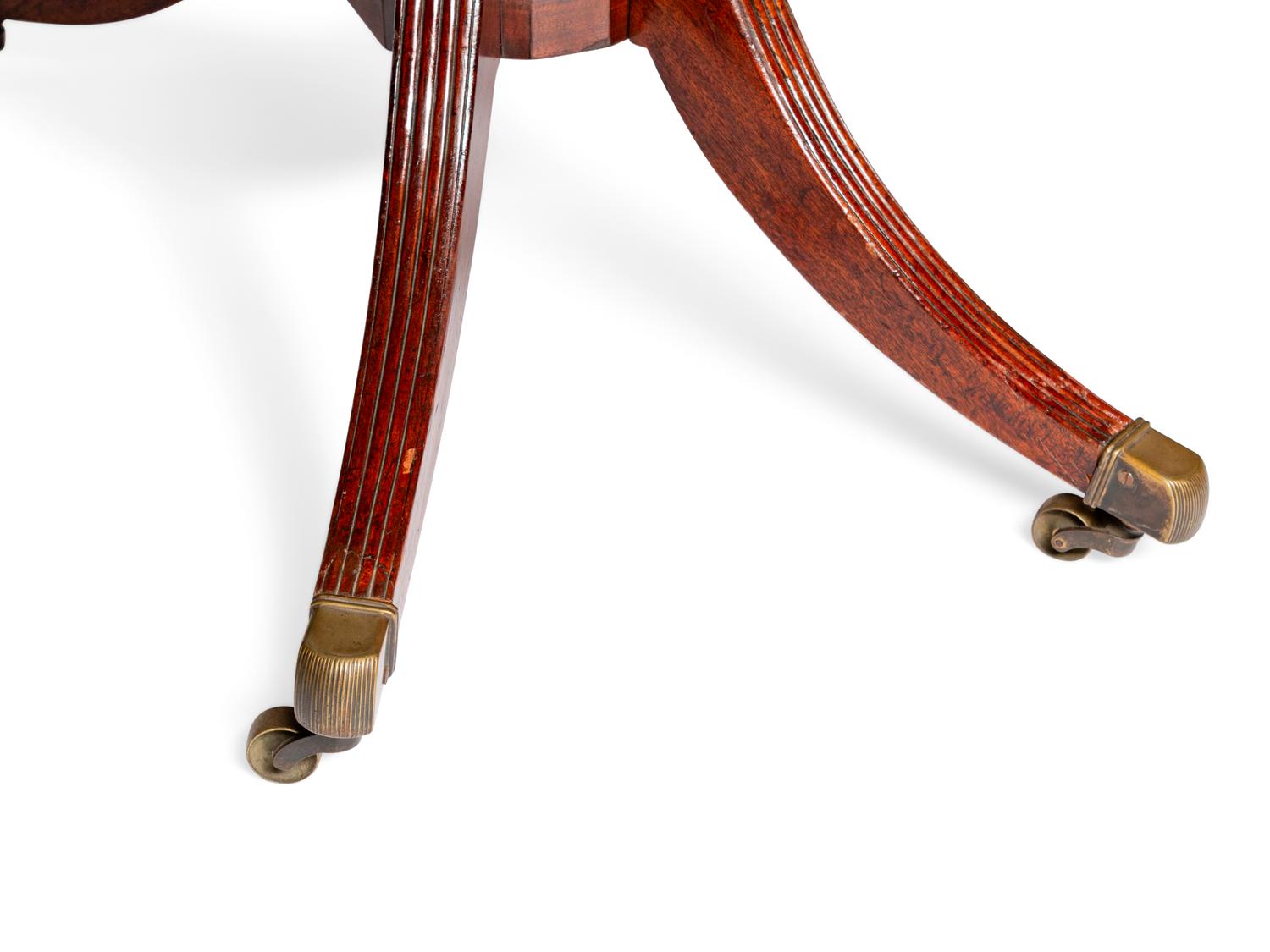A Regency Mahogany Three-Pedestal Dining Table