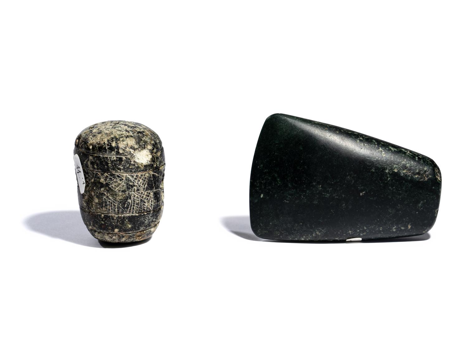 Two Near Eastern Stone Tools — An engraved macehead and axehead