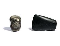 Two Near Eastern Stone Tools — An engraved macehead and axehead