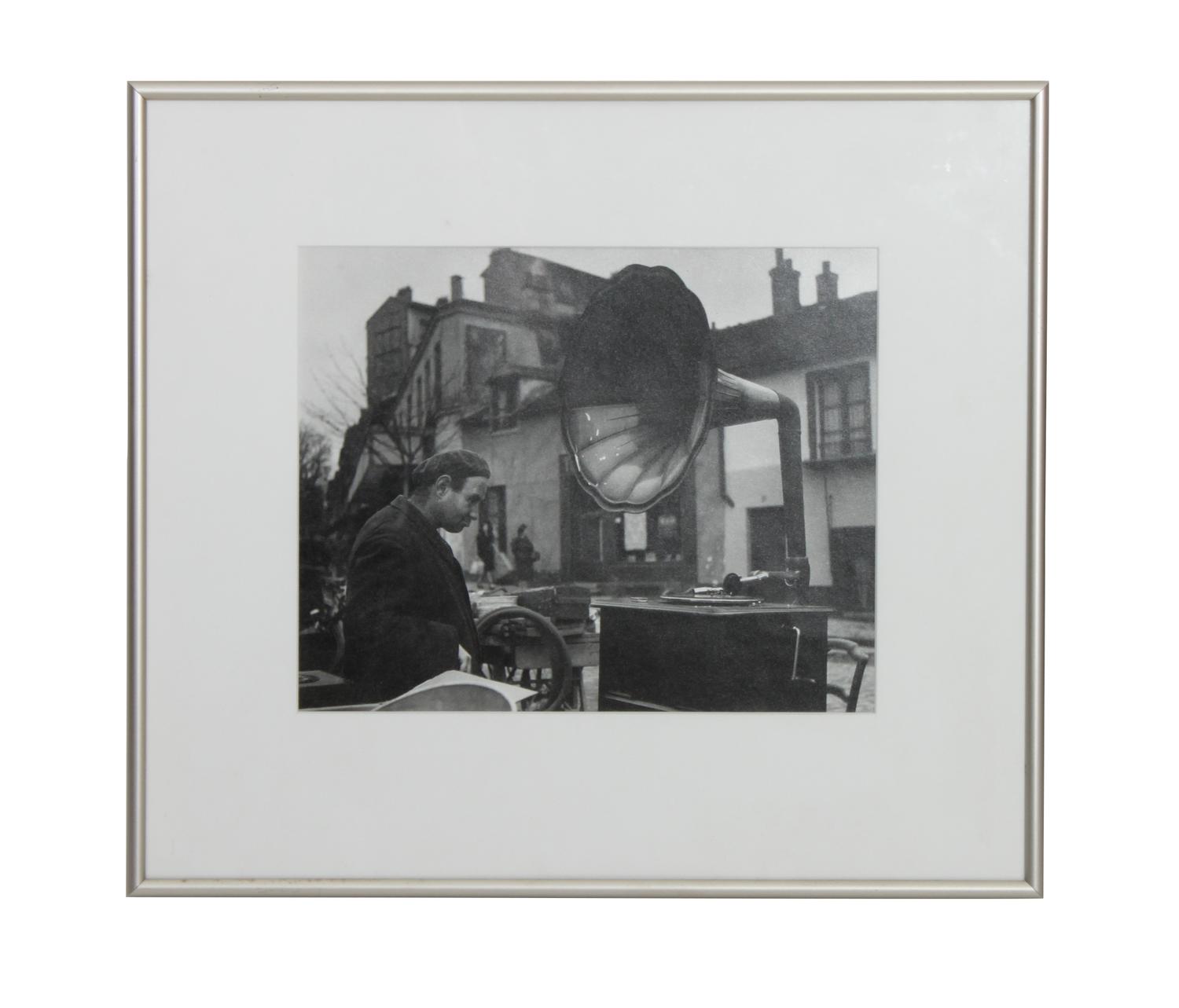 Robert Doisneau, (French, 1912-1994), Man with Phonograph, at Flea Market Paris