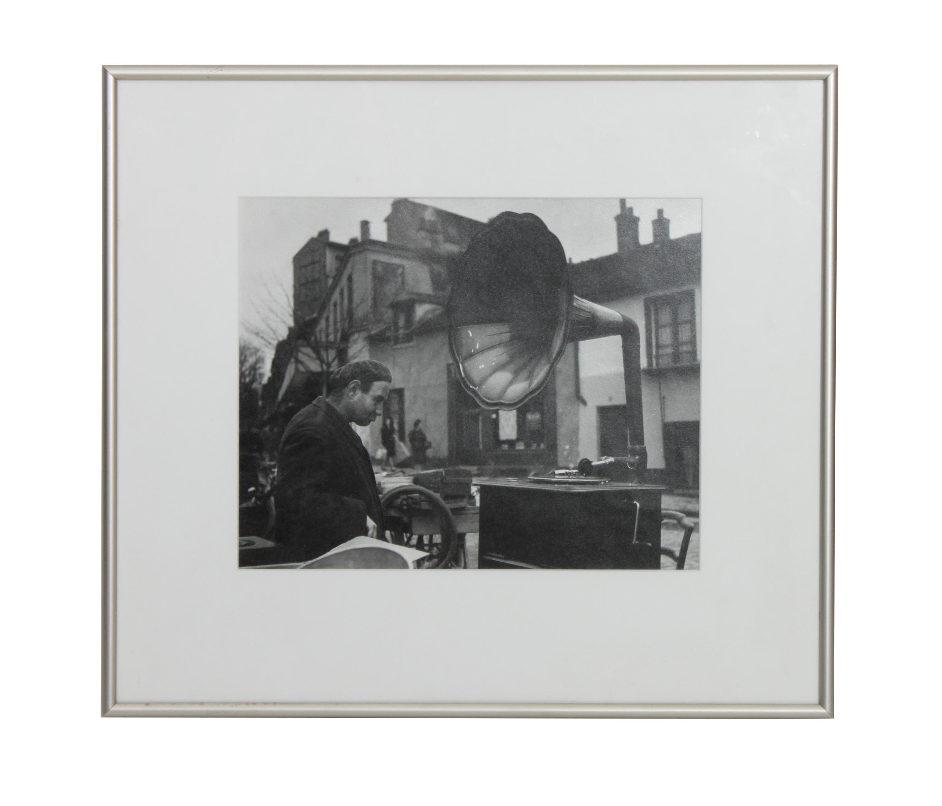 Robert Doisneau, (French, 1912-1994), Man with Phonograph, at Flea Market Paris