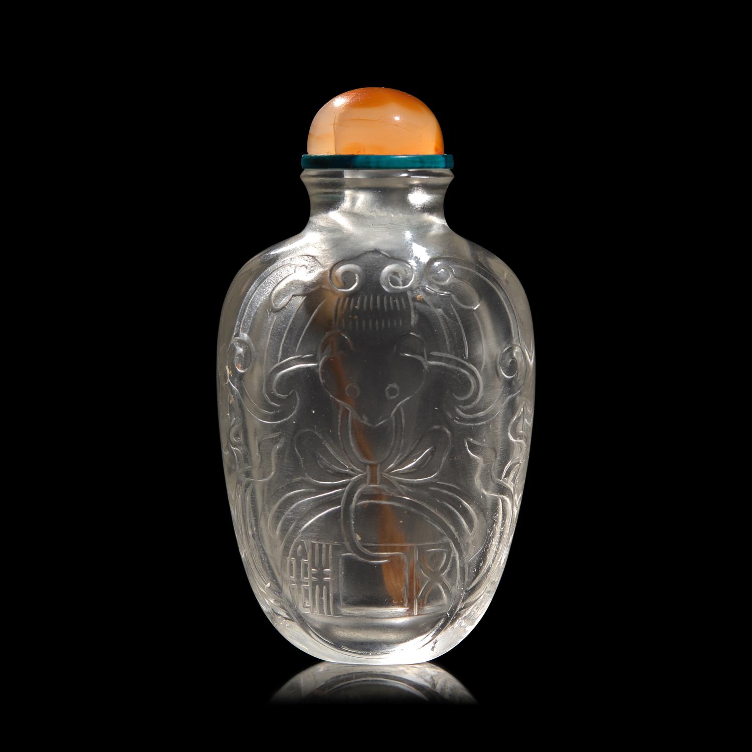 A Chinese Carved Rock Crystal "Bat and Coin" Snuff Bottle