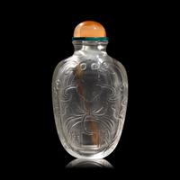 A Chinese Carved Rock Crystal "Bat and Coin" Snuff Bottle