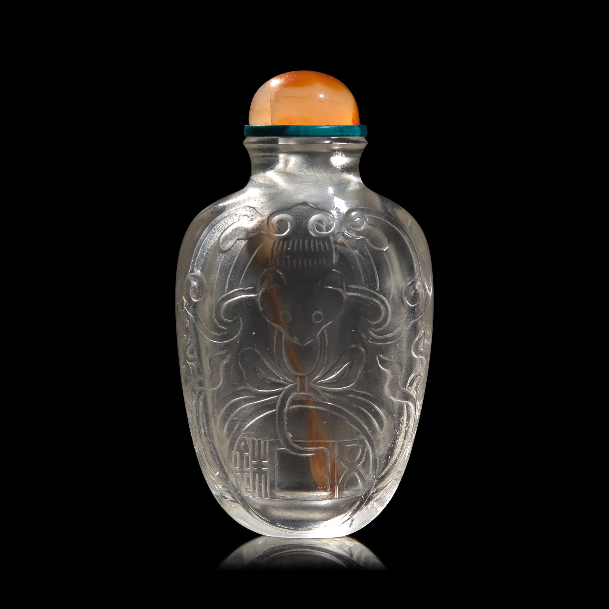A Chinese Carved Rock Crystal "Bat and Coin" Snuff Bottle