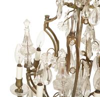 A Louis XV Style Gilt Bronze and Cut Glass Eight-Light Chandelier