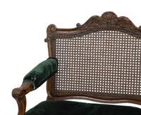 A Régence Style Carved Walnut Triple Chair-Back Settee