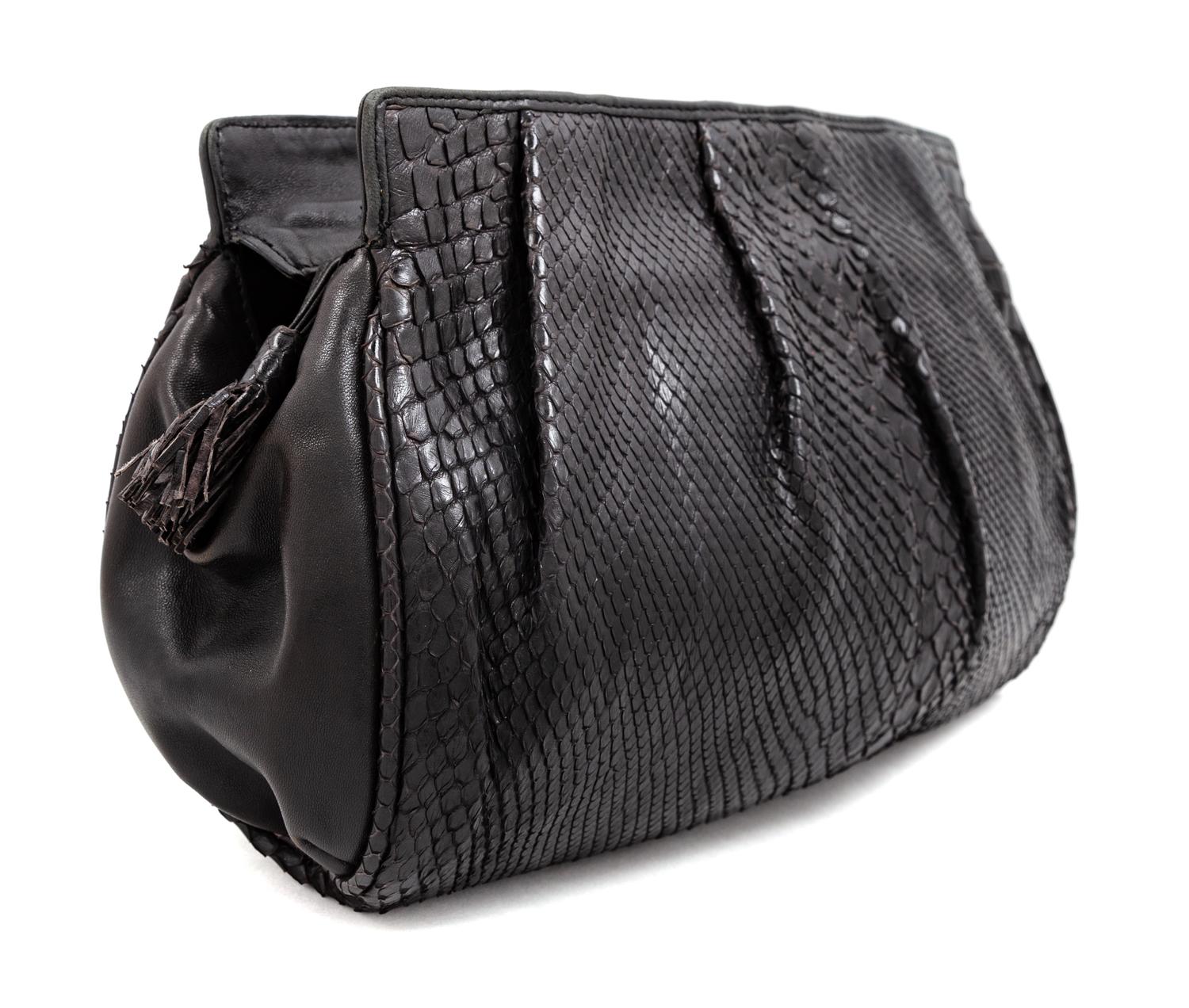 A Bottega Veneta Black Python Clutch, 8" H x 11.25" W x 1.5" D.