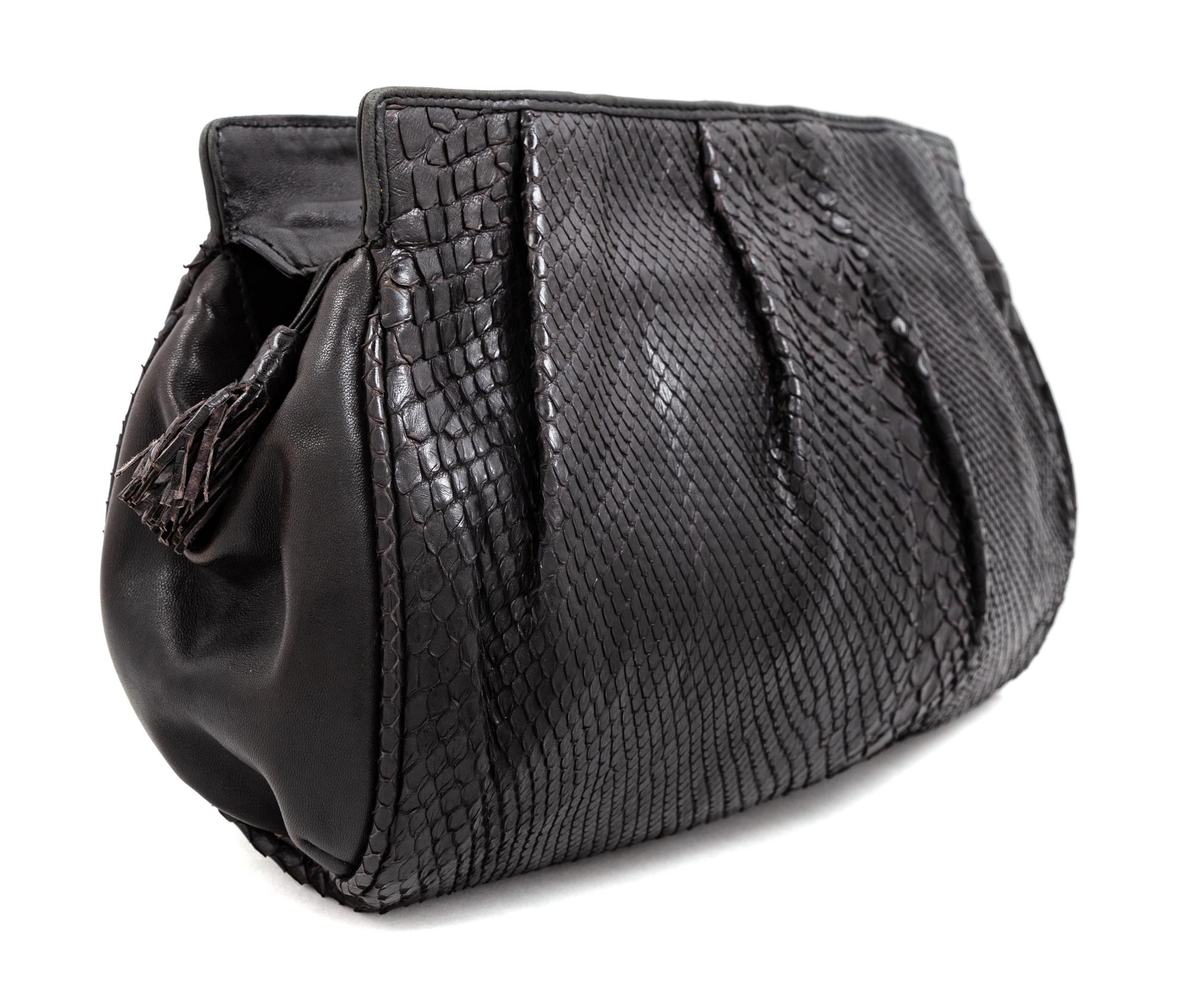 A Bottega Veneta Black Python Clutch, 8" H x 11.25" W x 1.5" D.