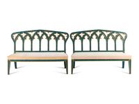 A Pair of English Gothic Revival Painted and Parcel Gilt Settees