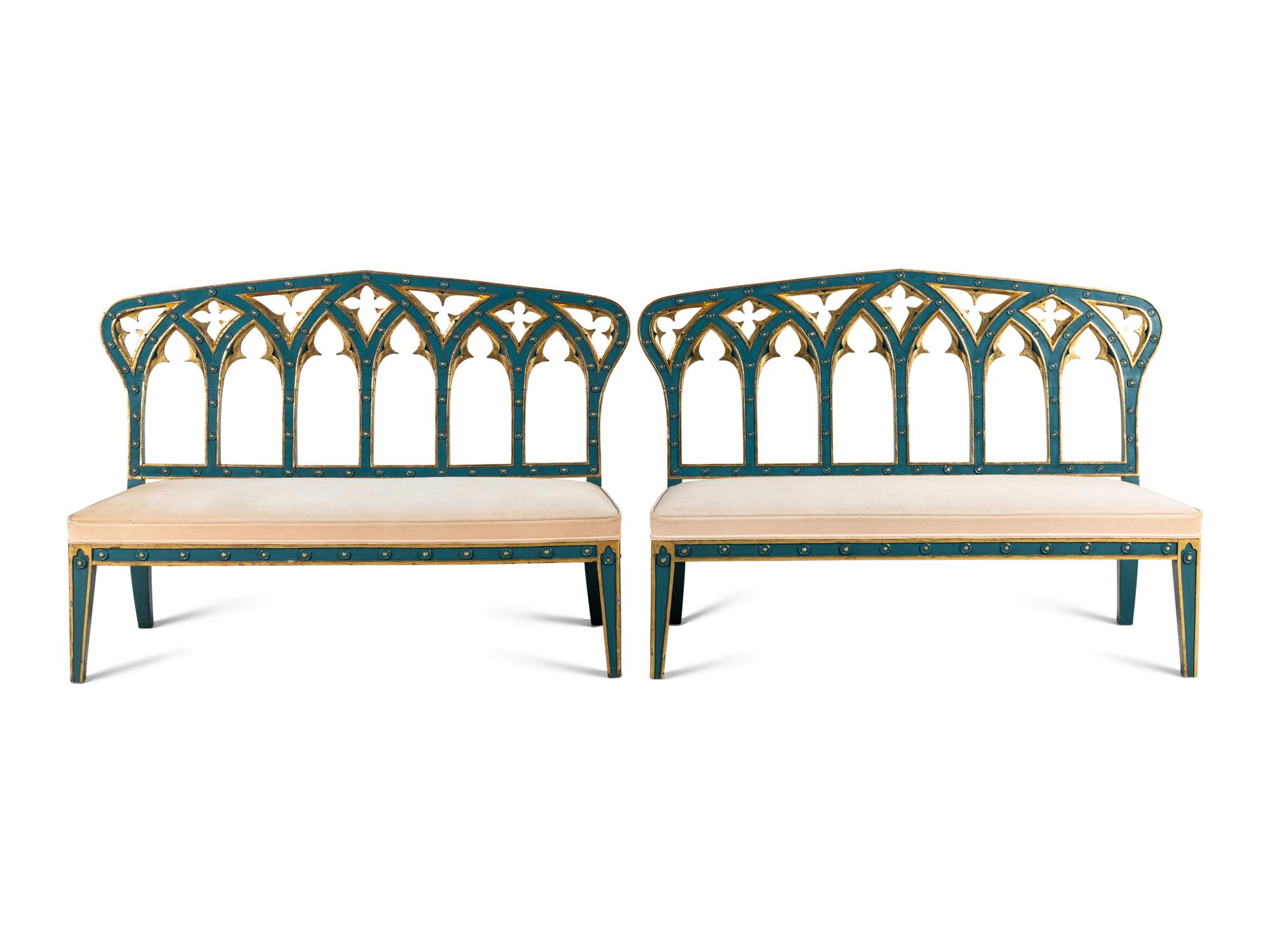 A Pair of English Gothic Revival Painted and Parcel Gilt Settees