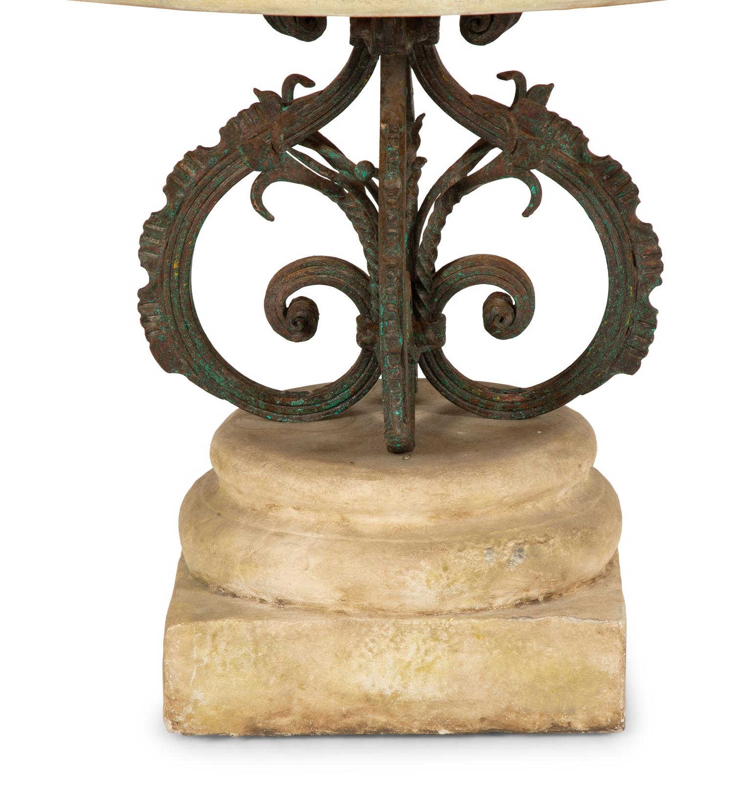 A Bronze and Stone Table with an Inlaid Stone Top