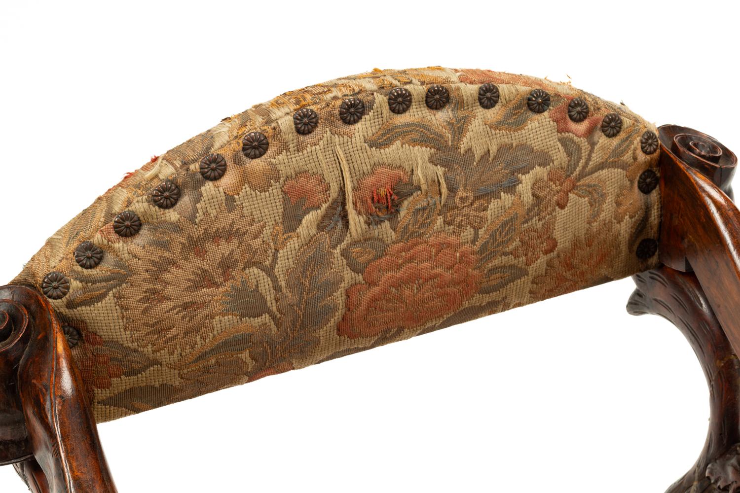 An Italian Carved Walnut Low Armchair