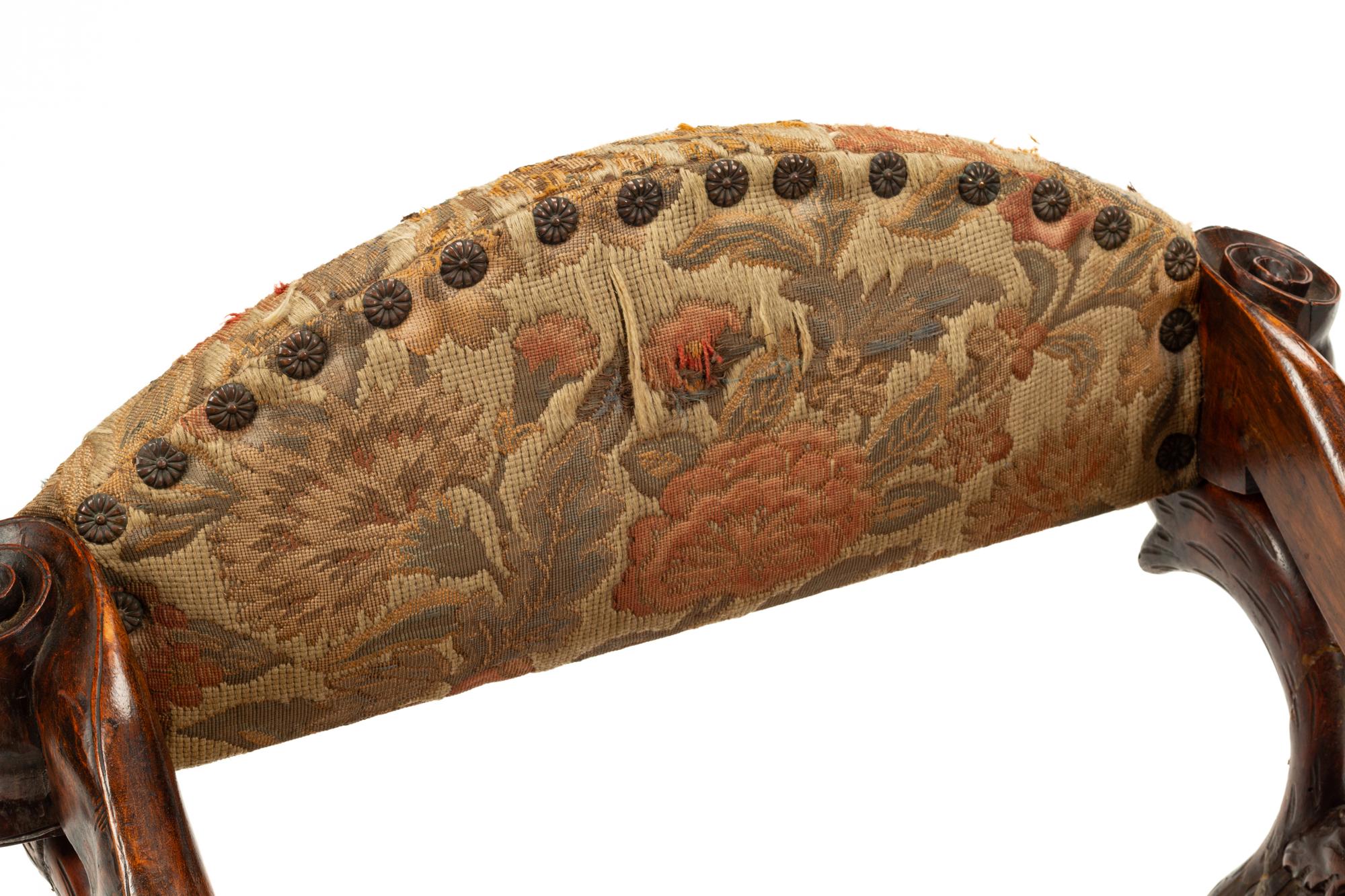 An Italian Carved Walnut Low Armchair