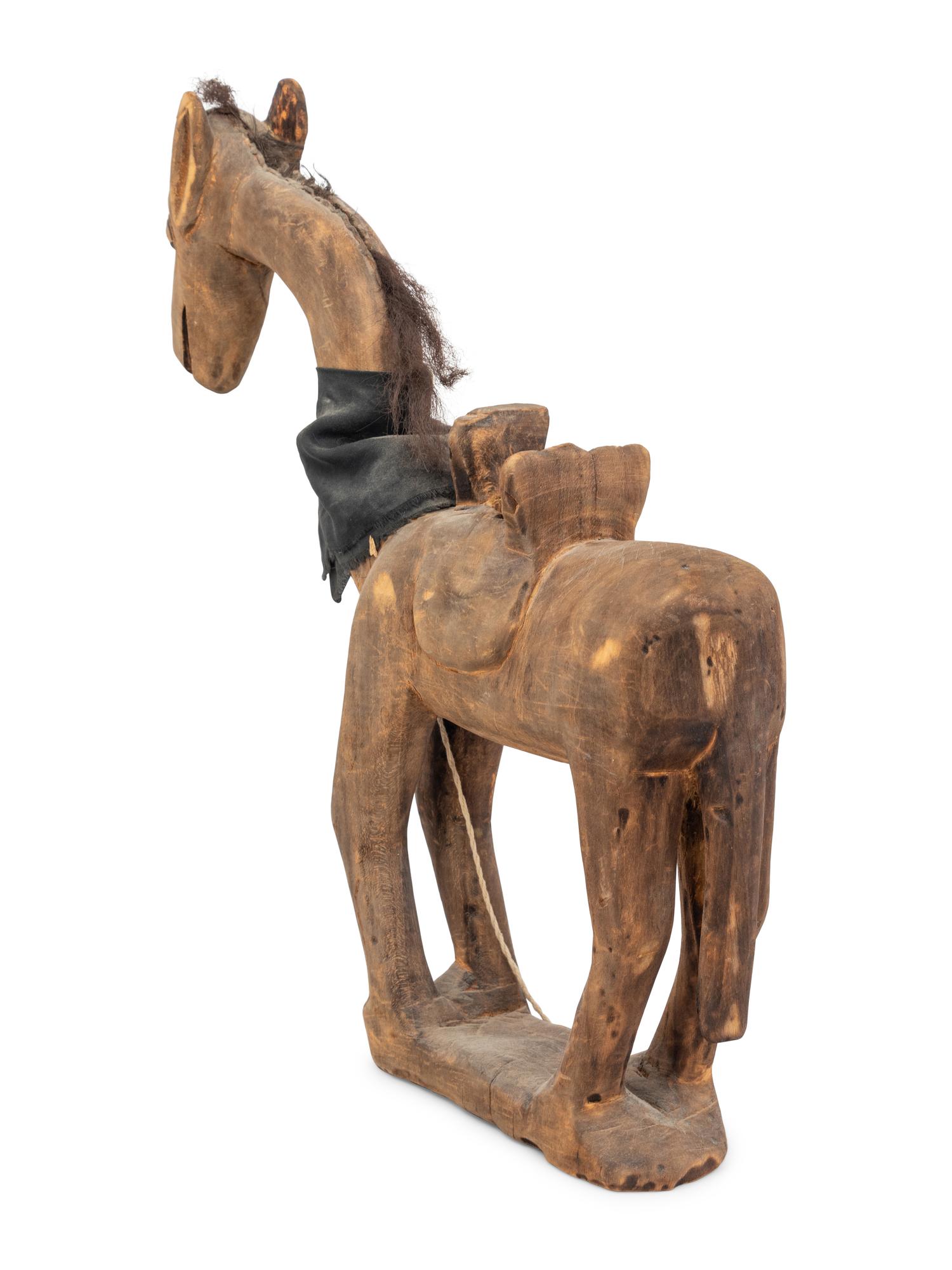 A Carved Wood Horse with Articulated Head