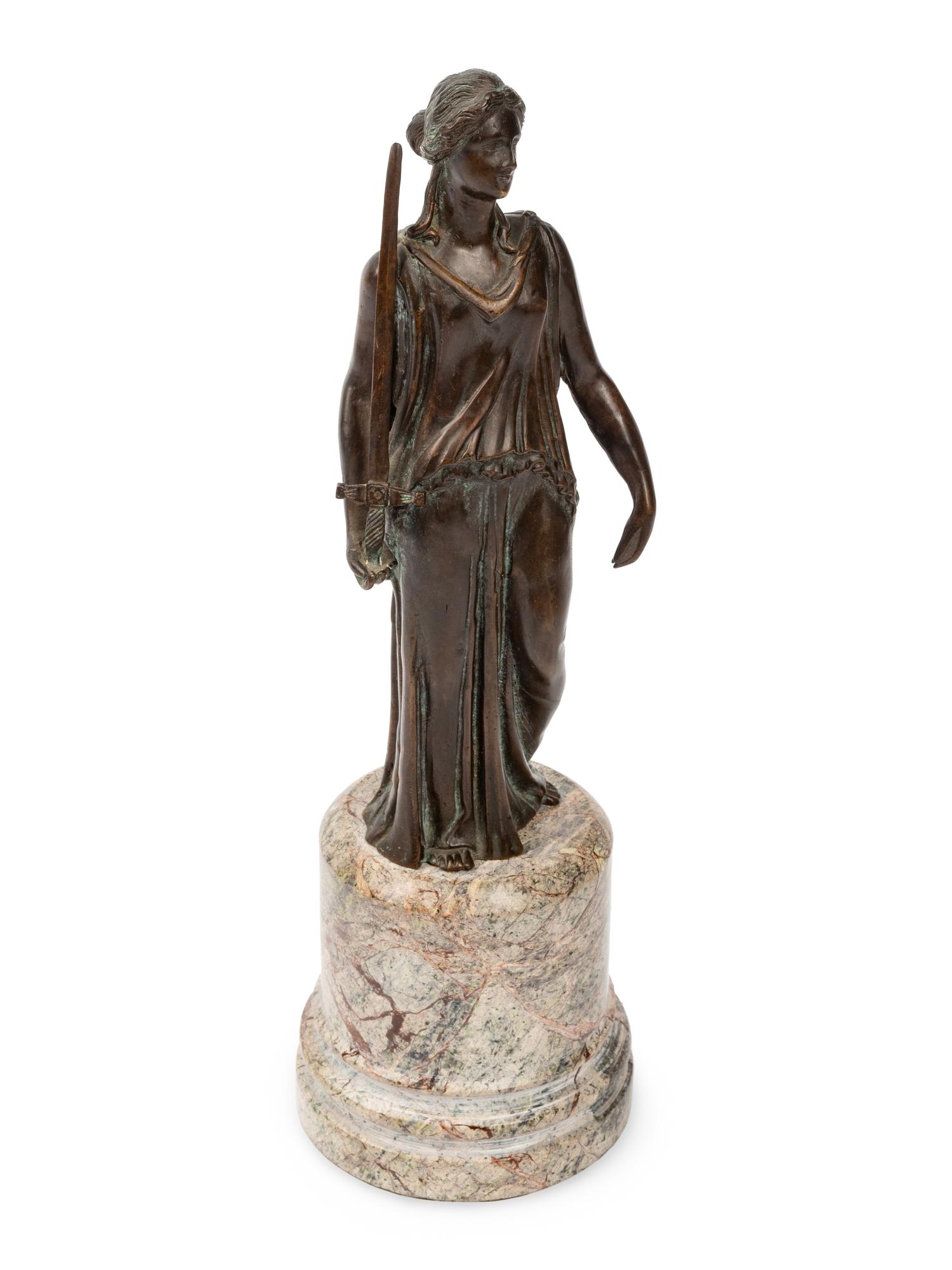 A Continental Patinated Bronze Figure on a Marble Base