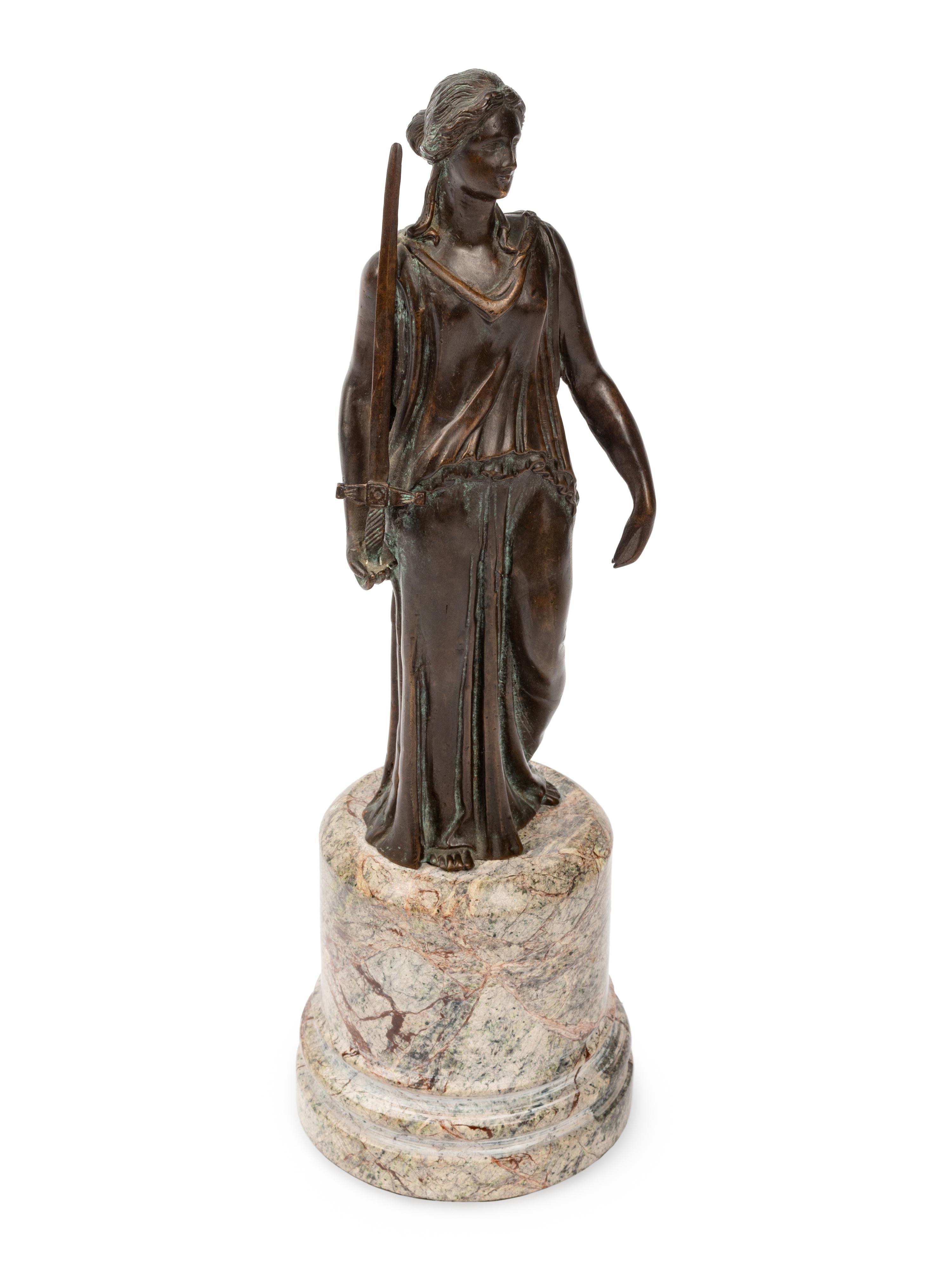 A Continental Patinated Bronze Figure on a Marble Base