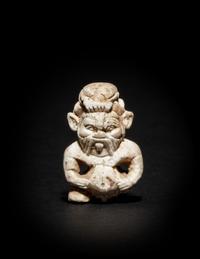 An Egyptian Glazed Steatite Amulet of Bes and Pataikos