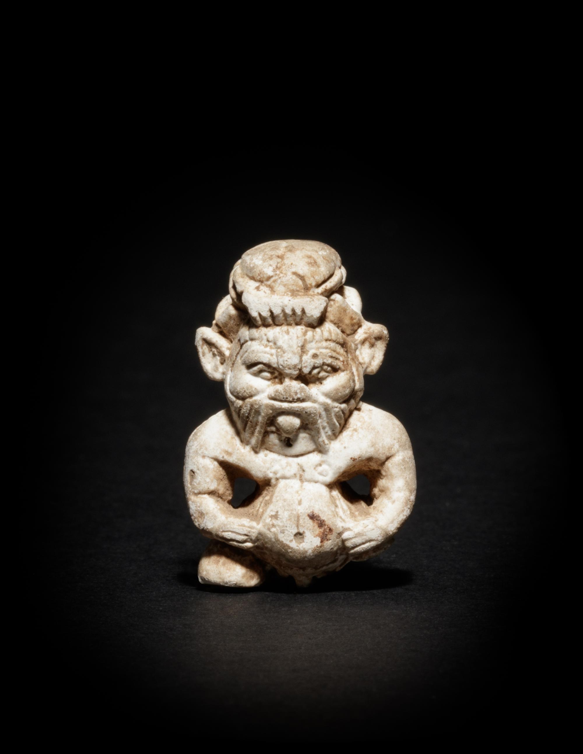 An Egyptian Glazed Steatite Amulet of Bes and Pataikos