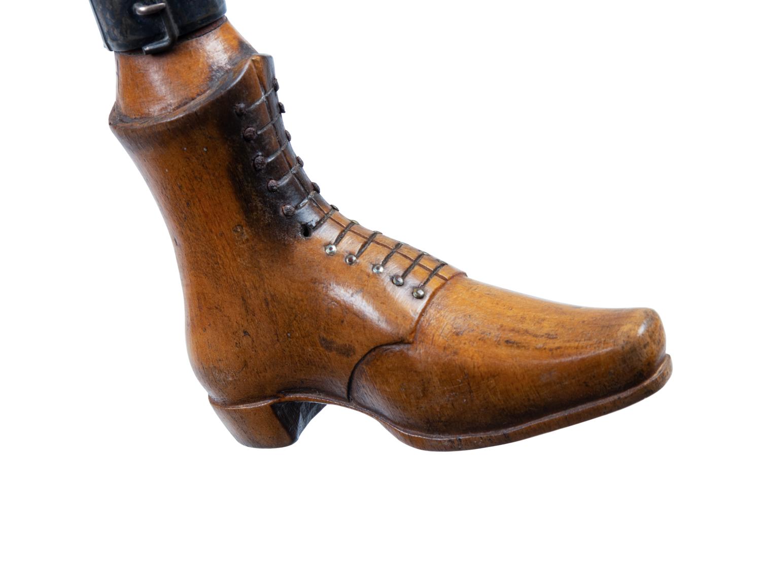 Two English Carved Wood Shoe-Form Canes