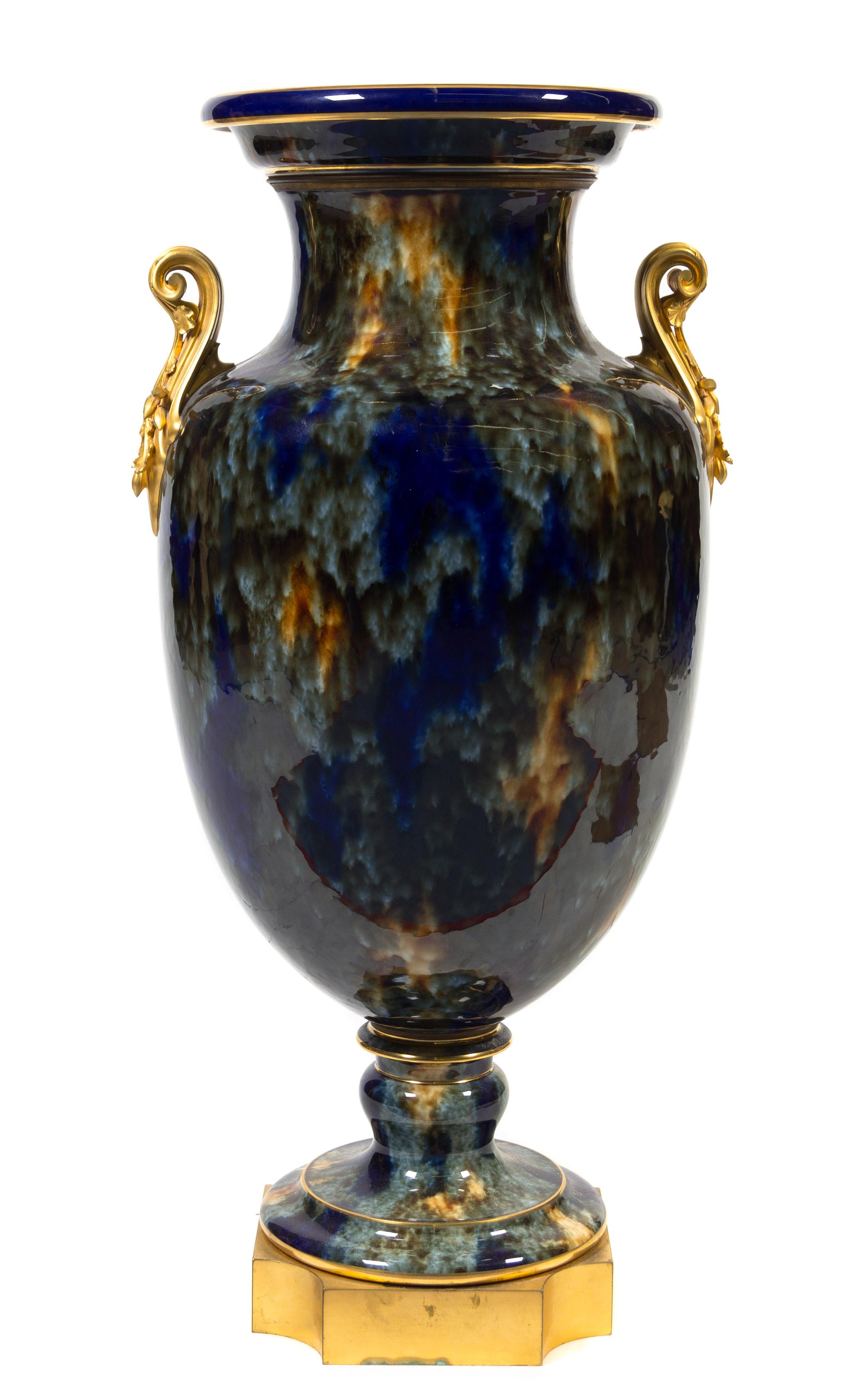A Sevres Gilt Bronze Mounted Porcelain Urn Height 35 1/2 inches.