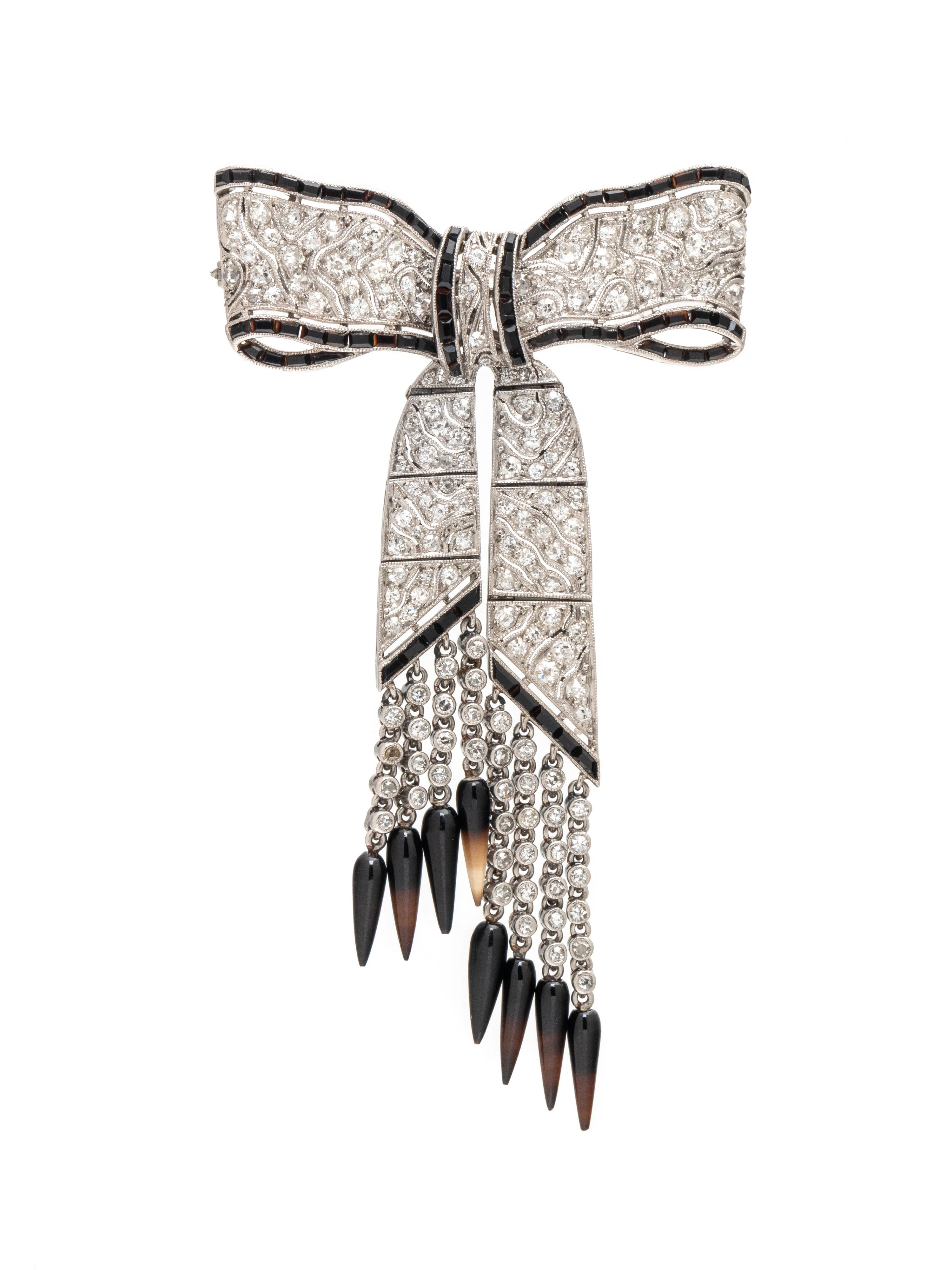 GATTLE, ART DECO, DIAMOND, BLACK ONYX, AND AGATE BOW BROOCH