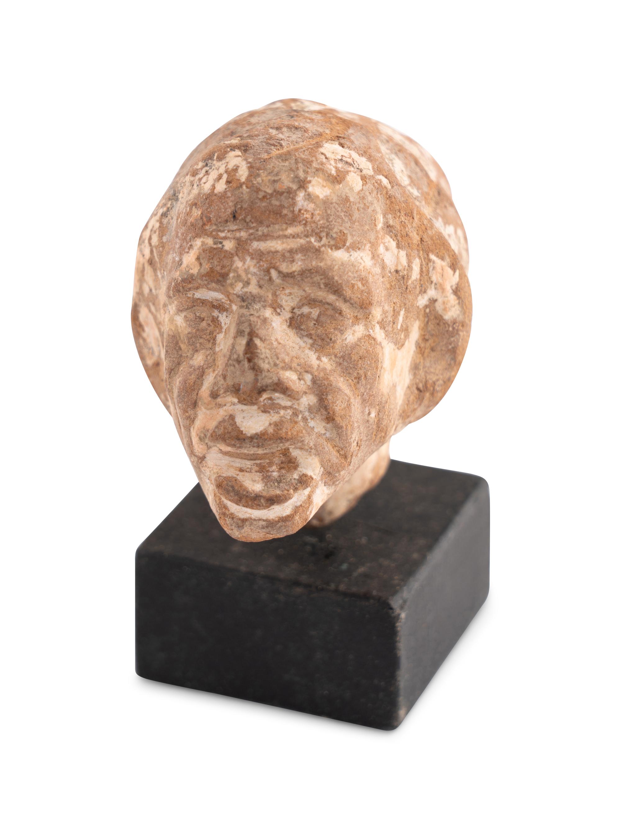 A Romano-Egyptian Terracotta Head of a Grotesque