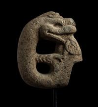 A Veracruz Stone Hacha in the Form of a Serpent Eating a Bird