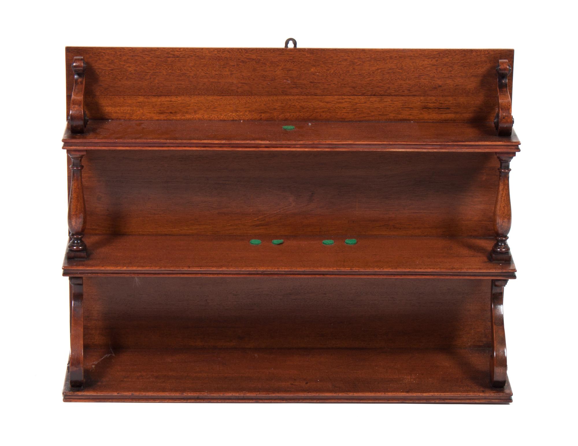 An English Mahogany Hanging Wall Shelf Height 22 1/4 inches.