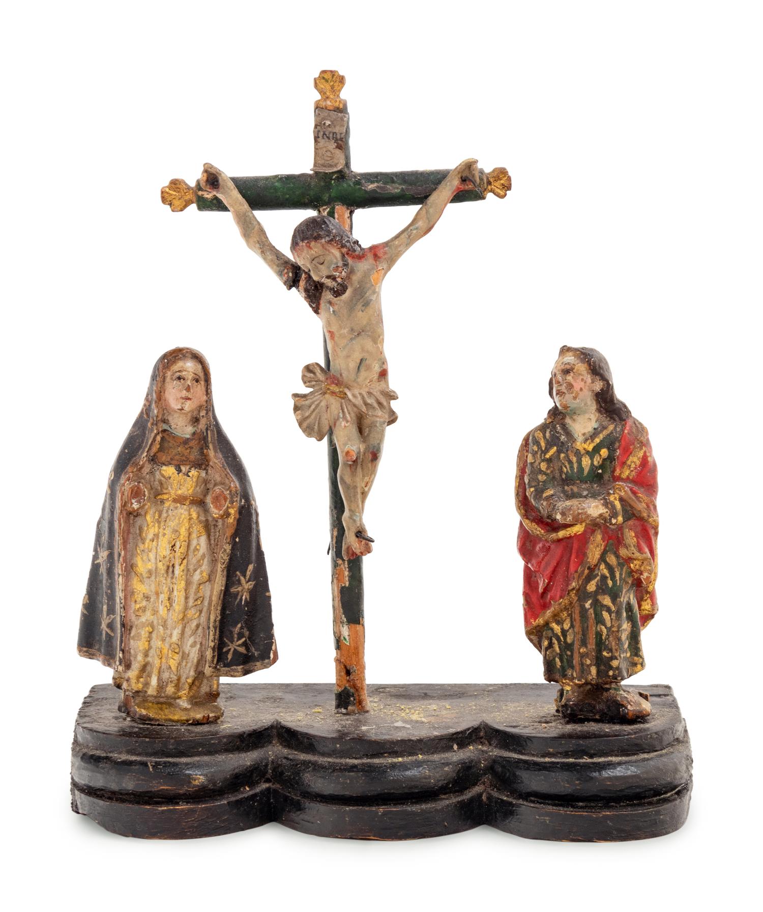 A Continental Carved and Polychrome Decorated Figural Group Depicting the Crucifixion