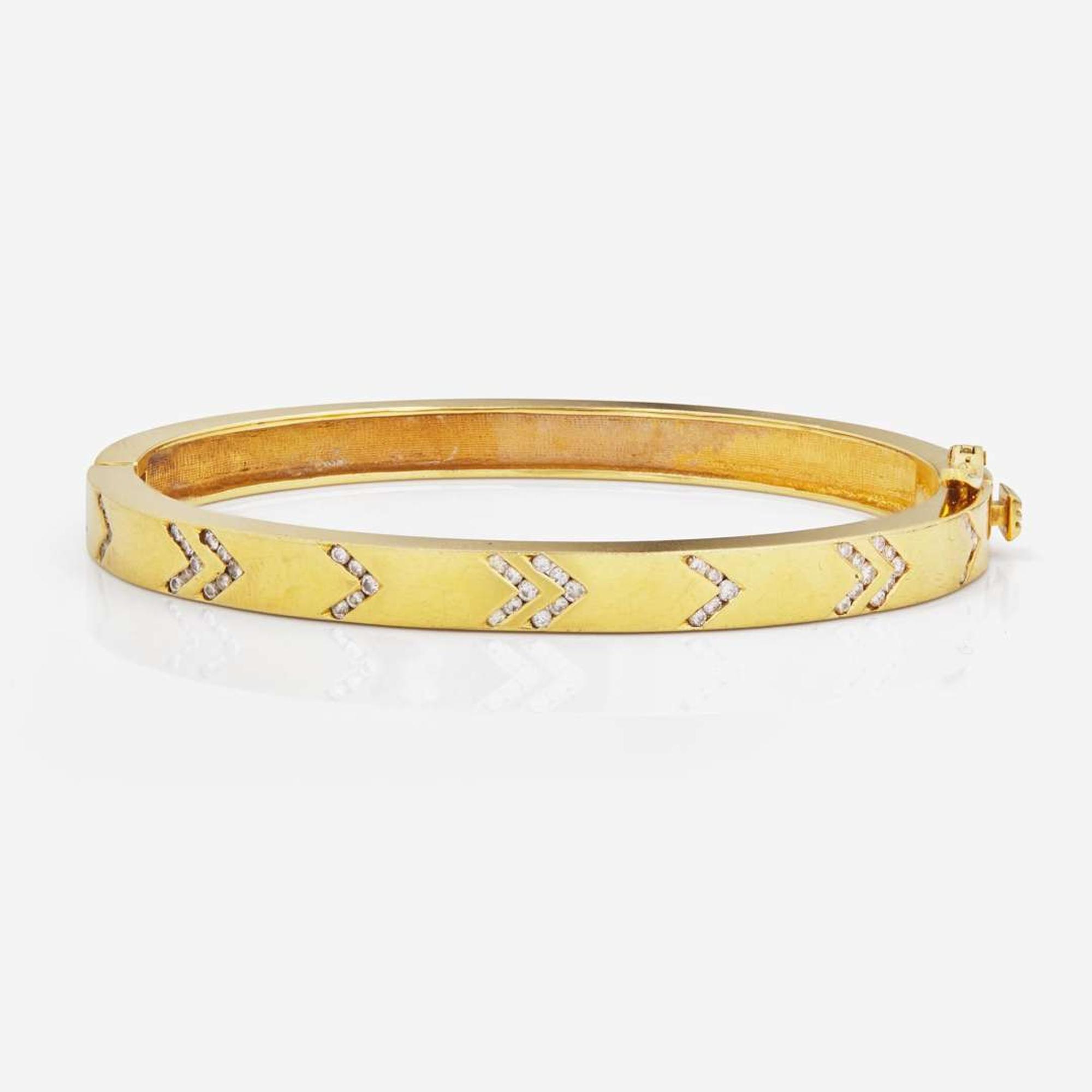 An 18K Yellow Gold and Diamond Bangle