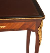 A Louis XV Style Gilt Bronze Mounted Kingwood and Mahogany Writing Table