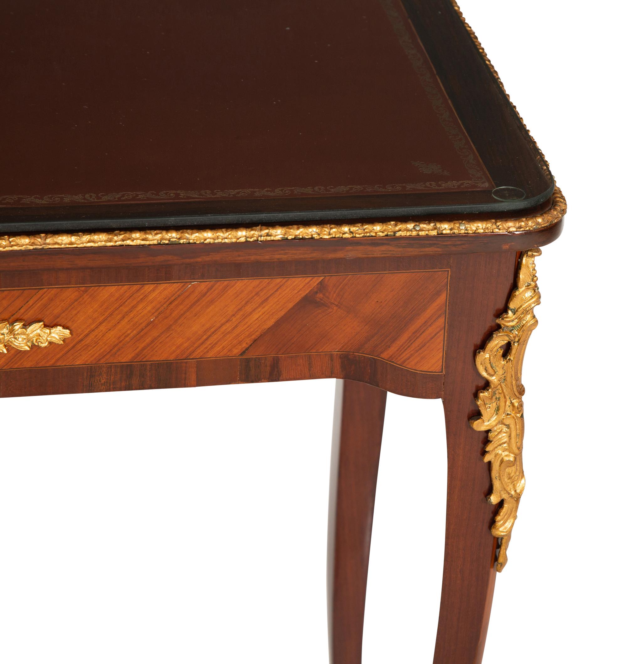A Louis XV Style Gilt Bronze Mounted Kingwood and Mahogany Writing Table