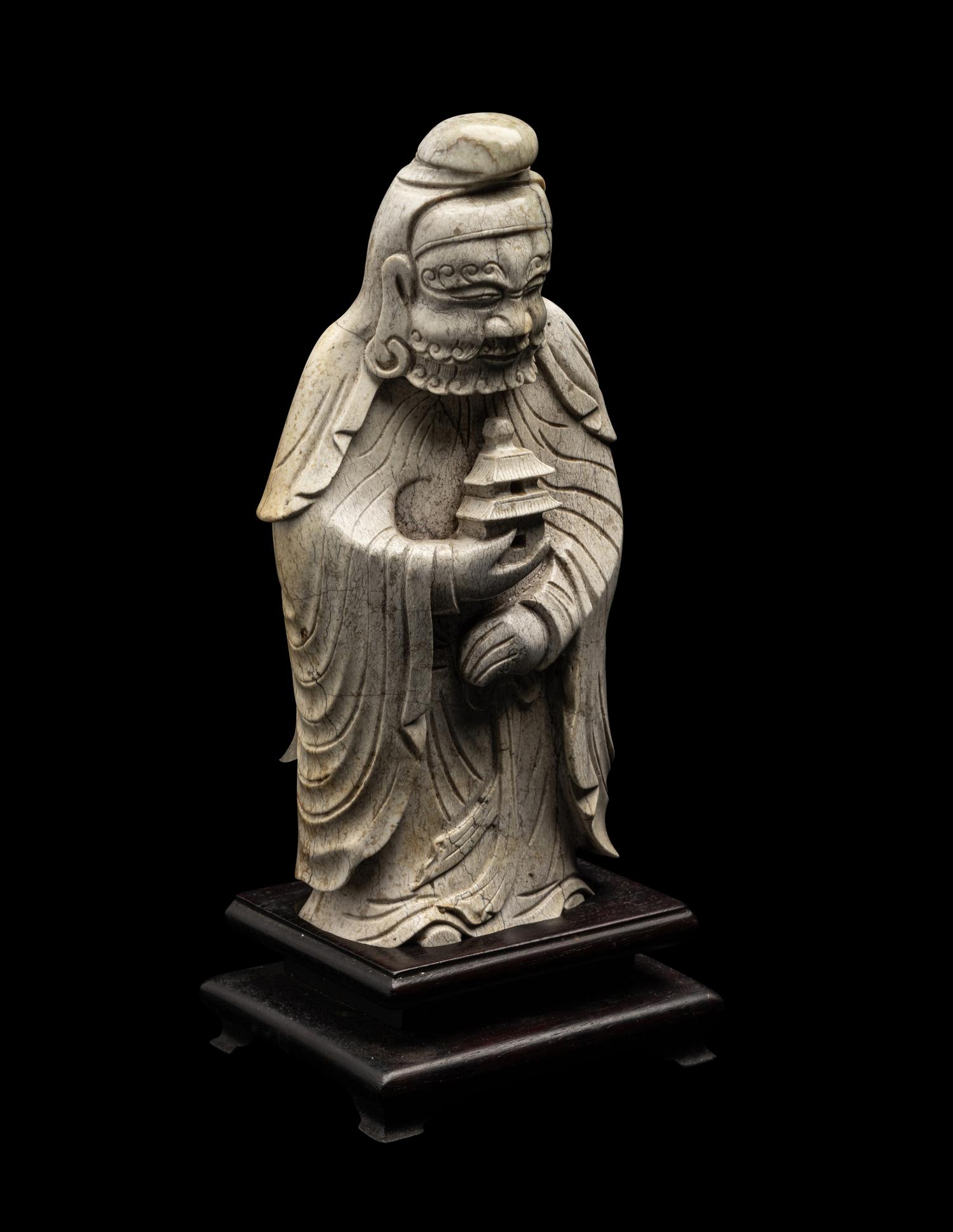 A Chinese Burnt Jade Figure of a Foreigner