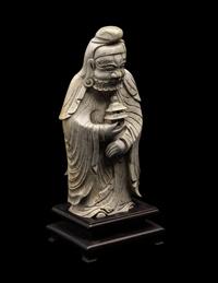 A Chinese Burnt Jade Figure of a Foreigner