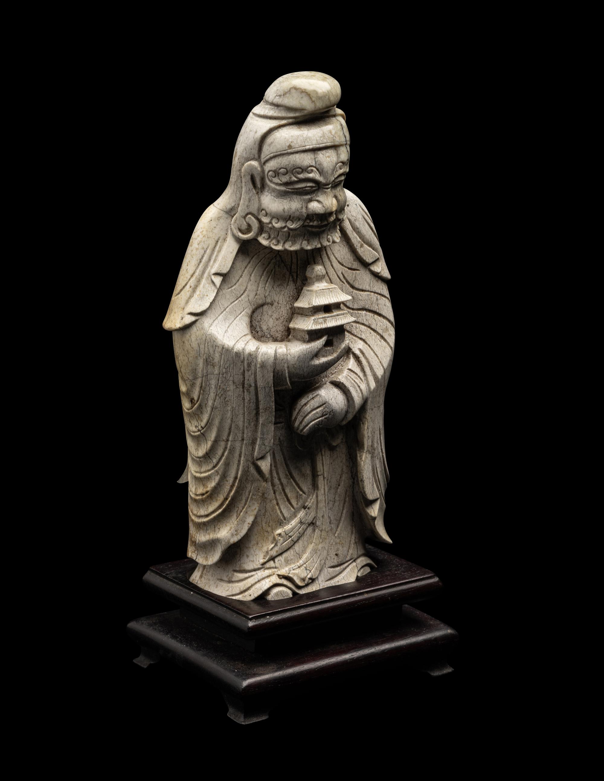 A Chinese Burnt Jade Figure of a Foreigner