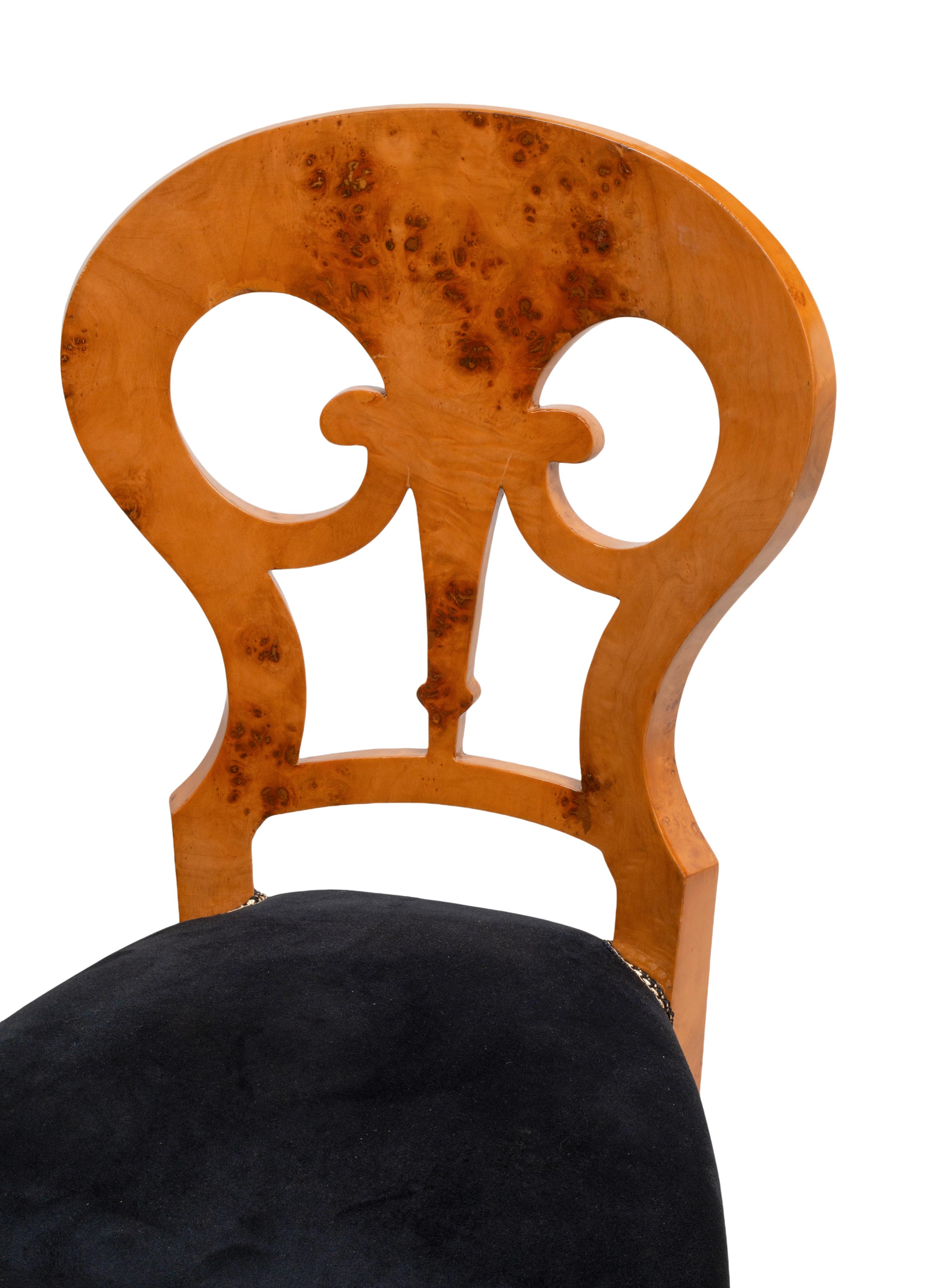 A Set of Twelve Biedermeier Style Burlwood Dining Chairs