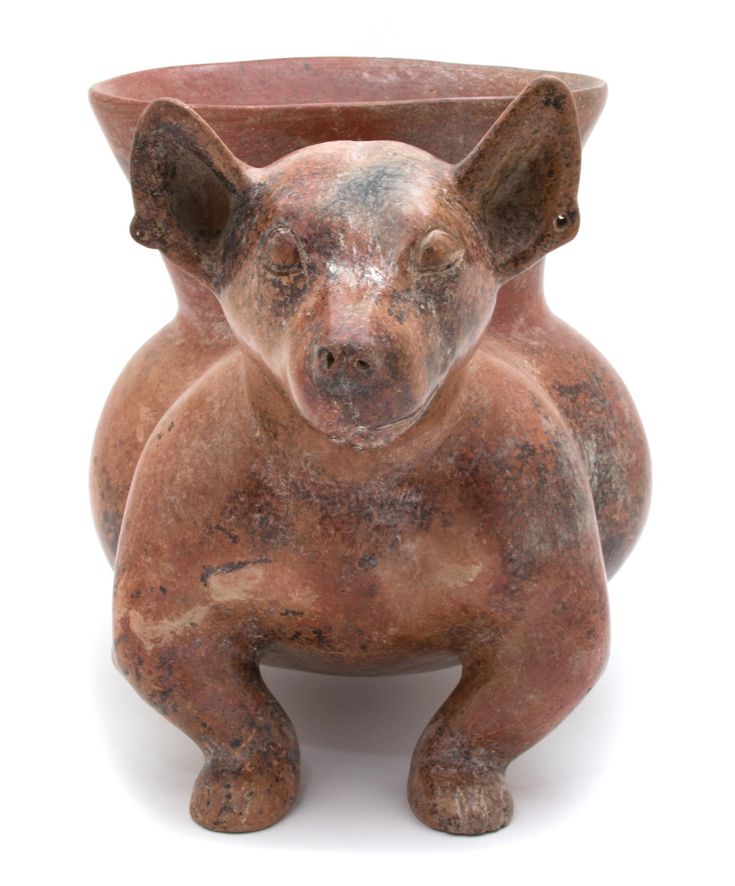 A Pre-Columbian Style Colima Dog-Form Vessel Height 11 x width 9 x depth 18 inches.
