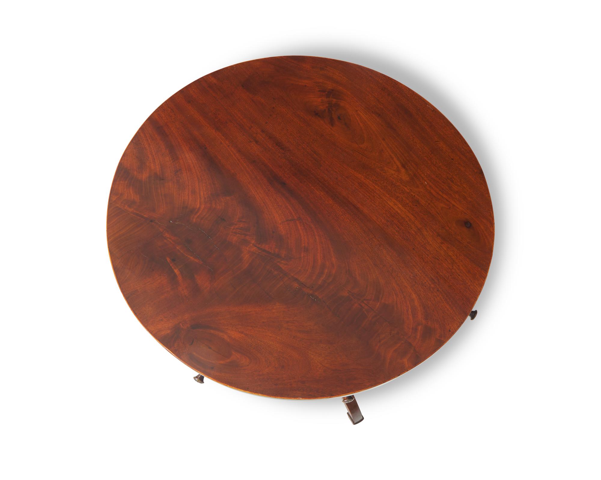 A small Regency inlaid mahogany drum table, circa 1820