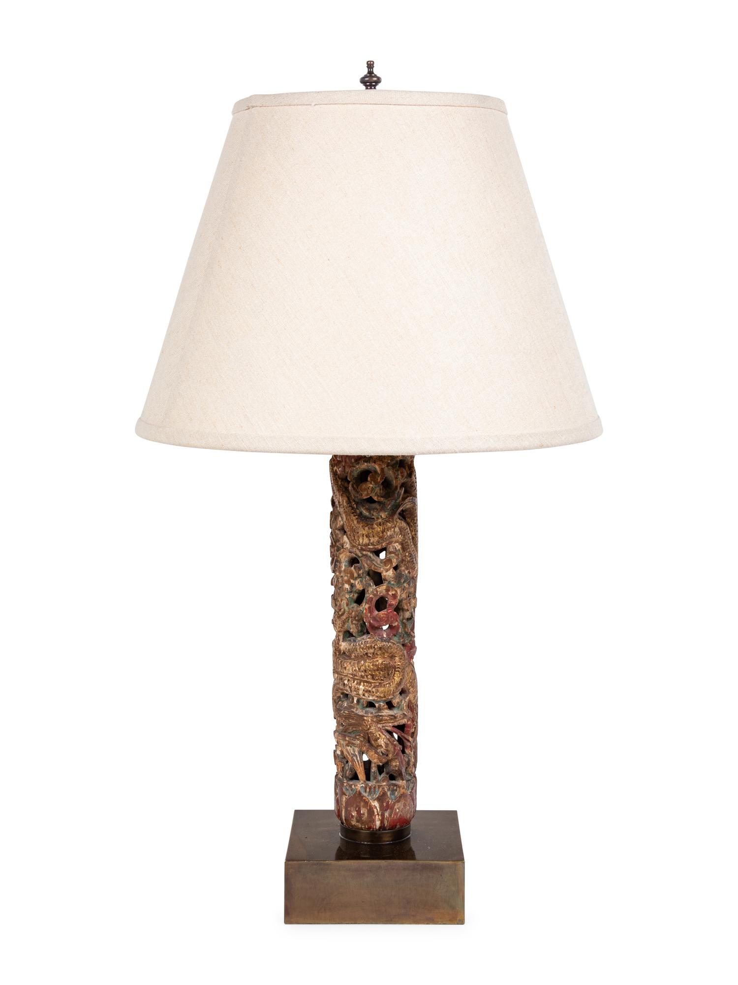 A Chinese Pierce Carved, Painted and Gilt Wood Lamp with a Linen Shade