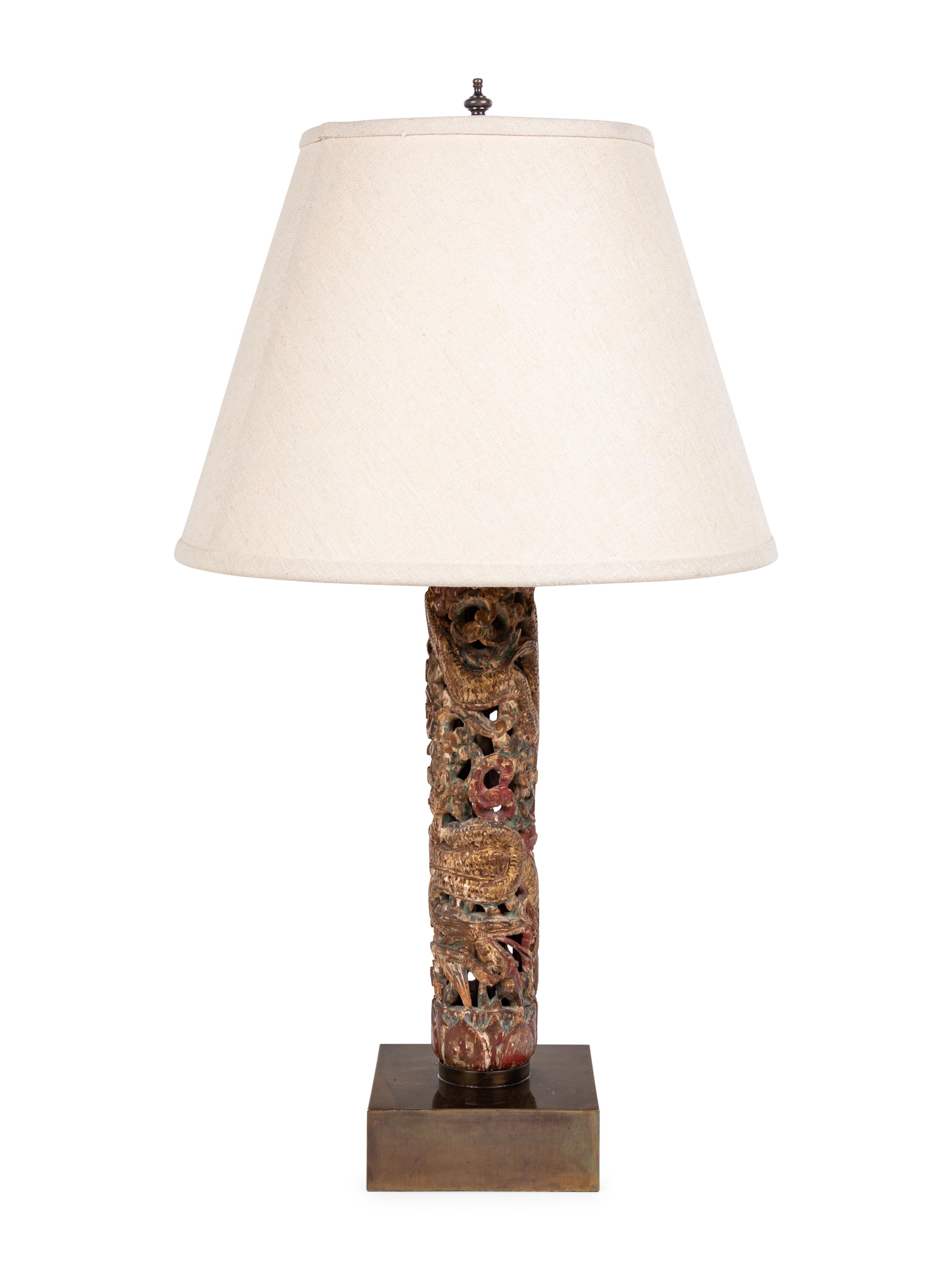 A Chinese Pierce Carved, Painted and Gilt Wood Lamp with a Linen Shade